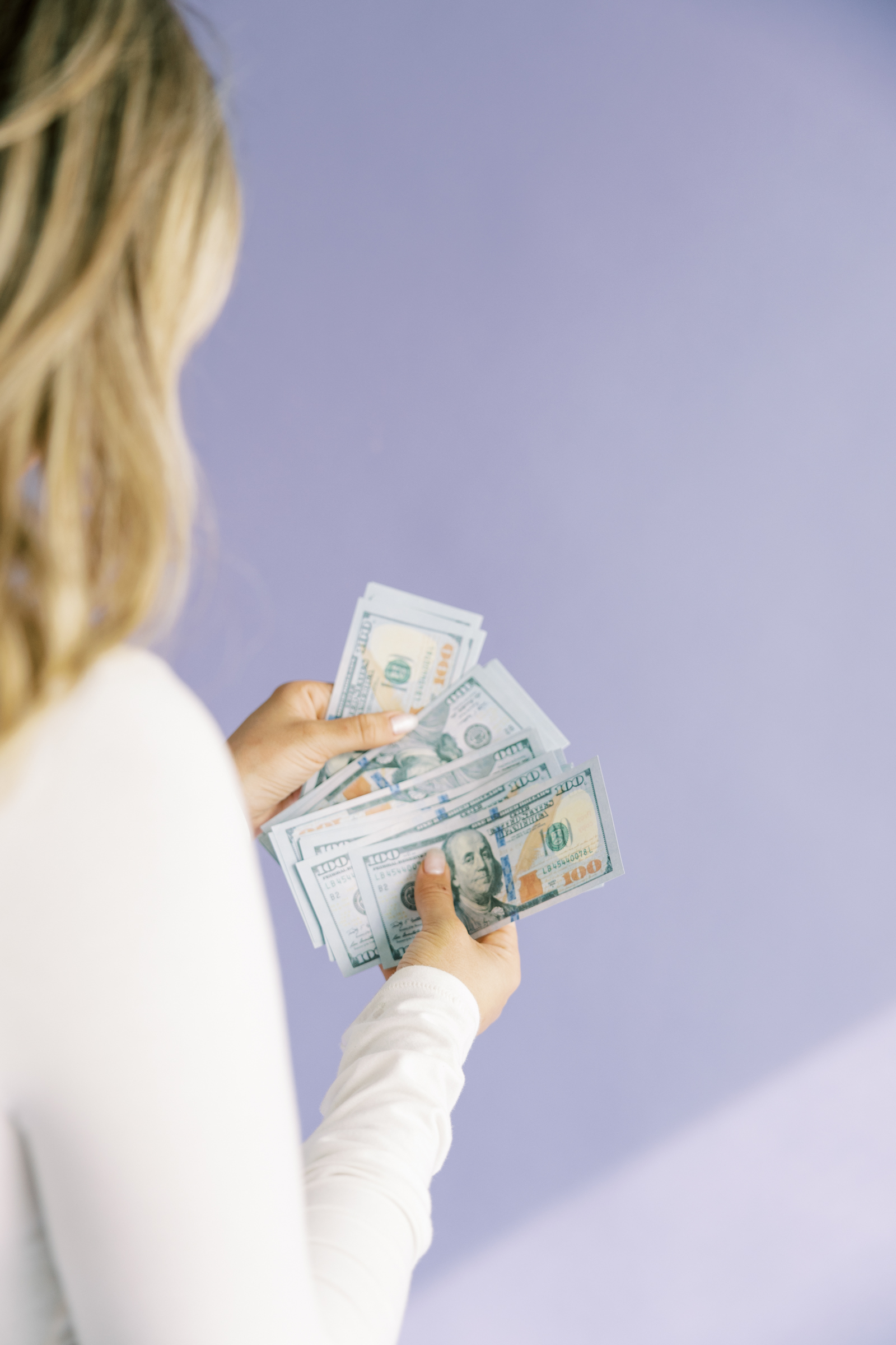 woman looking at money