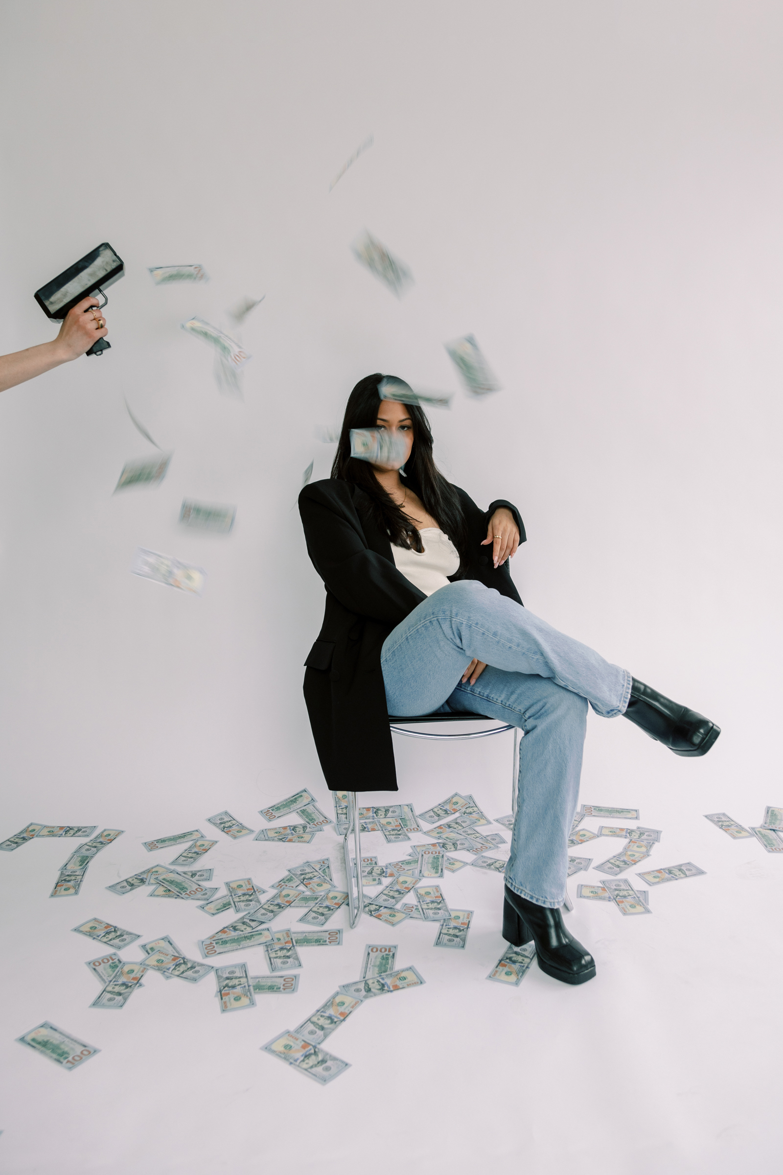 A woman surrounded by money